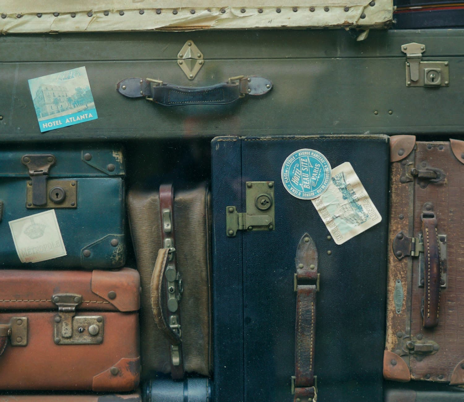 A stack of travel cases carrying old hotel luggage labels