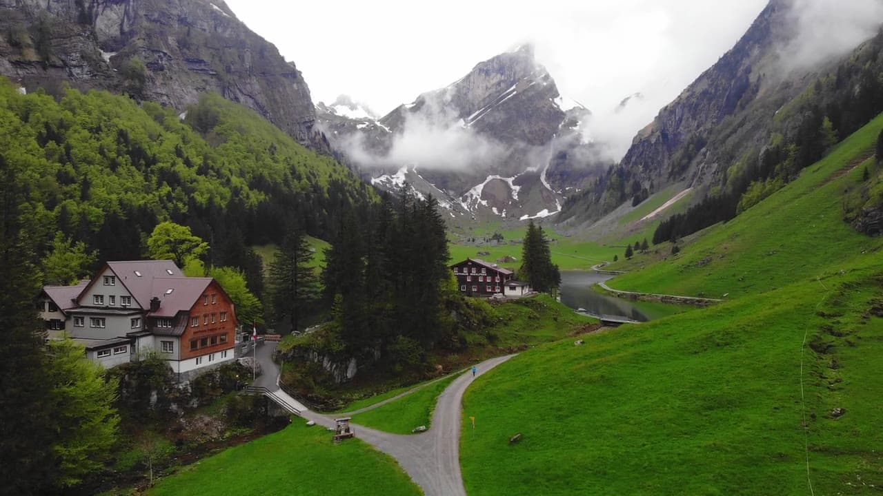 Aerial view across an alpine valley and lake